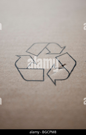 International recycling symbols on a piece of cardboard, December 2009. Stock Photo
