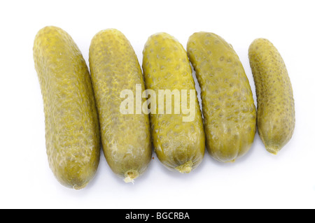 Salty pickled cucumbers isolated over white Stock Photo