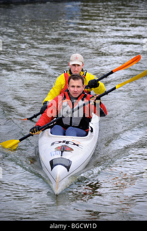 Major Dave Bradley (left) and Steve Vinall warm up at the starting point for The Devizes to Westminster Canoe race, during which Stock Photo