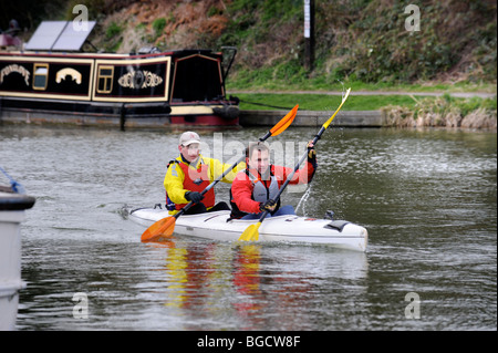 Major Dave Bradley (left) and Steve Vinall warm up at the starting point for The Devizes to Westminster Canoe race, during which Stock Photo