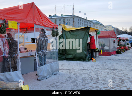 The vendors tent booths in the Helsinki Market Square at the wintertime. Helsinki, Finland, Scandinavia, Europe. Stock Photo