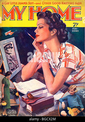 My Home, Feb 1940 magazine cover for the lifestyle magazine as a girl writes a letter to her man in the forces Stock Photo