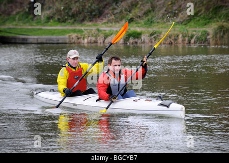 Major Dave Bradley (left) and Steve Vinall warm up at the starting point for The Devizes to Westminster Canoe race, during which Stock Photo