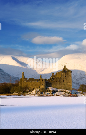 Looking across a frozen Loch Awe to the ruins of Kilchurn Castle in Argyle, Scotland. Winter (Dec) 2009. Stock Photo