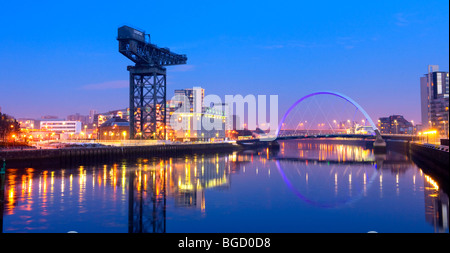 Looking to Finnieston crane and squinty bridge on the River Clyde, Glasgow at night. Winter (Dec) 2009. Stock Photo