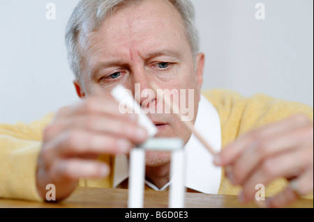 Man, engineer, inventor, architect thinking, playing, inventing, planing, constructing Stock Photo