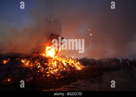 wood boat burning for a taiwanese festival Stock Photo