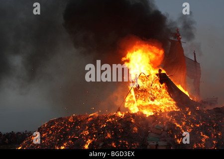 wood boat burning for a taiwanese festival Stock Photo