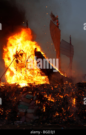 wood boat burning for a taiwanese festival Stock Photo