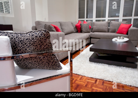 modern living room interior with charcoal sofa and chocolate brown coffee table
