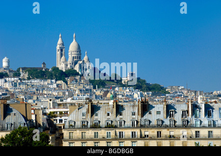 View of the Sacré Coeur Basilica (1875-1914) or Church on Montmartre Hill or 'butte' from the Roof Terrace of the Orsay Museum, Paris France Stock Photo