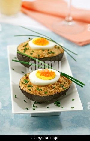 Stuffed avocados. Recipe available. Stock Photo