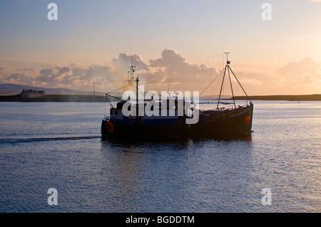 A dive boat Leaves Stromness harbour to explore the Scapaflow area of the Orkney Isles.  SCO 5669 Stock Photo