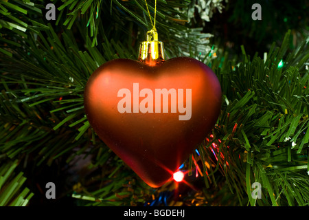 Heart shaped decoration on Christmas Tree Stock Photo