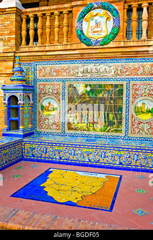 Alcove of decorated ceramic tiles depicting a scene in the province of Huesca at Plaza de Espana, Parque Maria Luisa, City of Se Stock Photo