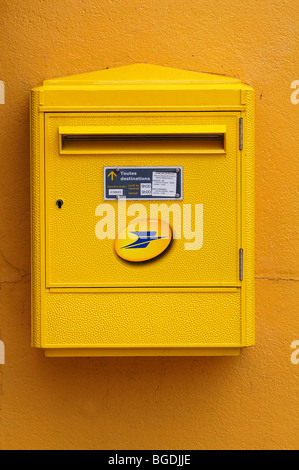 Yellow French post box on a yellow wall, Illhaeusern, Alsace, France, Europe Stock Photo