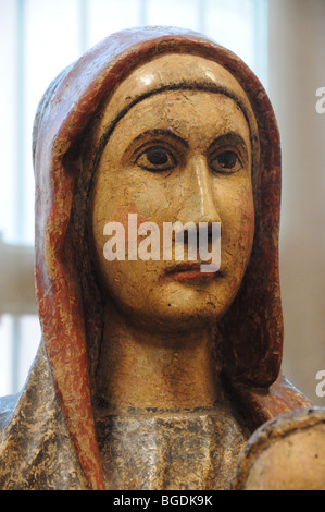 Close up portrait detail of 13TH century painted wooden sculpture of Madonna col Bambino Museo Poldi Pezzoli Milan Italy Stock Photo
