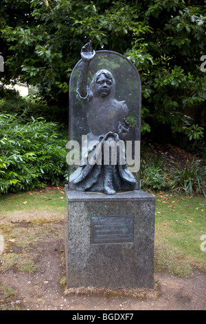 Alice Through The Looking Glass statue in Castle Grounds, Guildford, Surrey, England Stock Photo