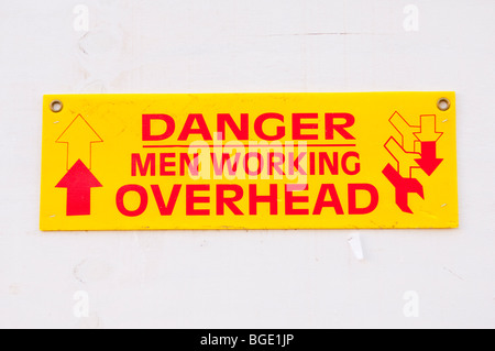 A sign reading Danger men working overhead Stock Photo