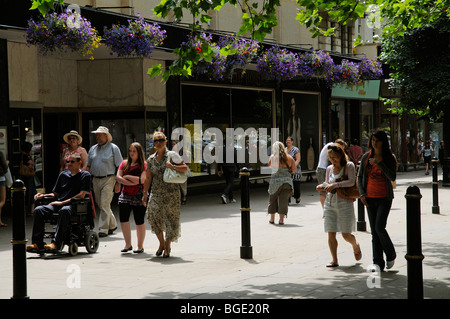 Shoppers in Cheltenham town centre Gloucestershire England UK Stock Photo