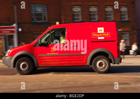 The Royal Mail Centre with red transit postal van parked outside ...