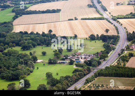 aerial view of the A14 road in Suffolk, UK also showing the Rougham Estate Farm Stock Photo