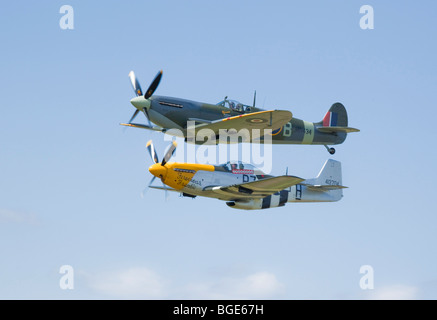 formation flying  of a P51 Mustang and Spitfire at air show 2009 Stock Photo