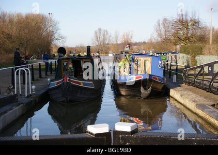 Narrowboats enter Stanstead Lock, River Lea navigation, Ware, Hertfordshire, England Stock Photo