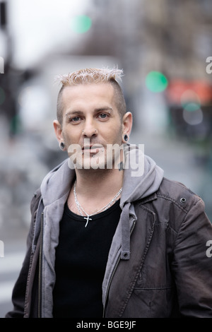 portrait of a  man with piercing and tattoos Stock Photo