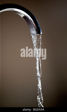 Water running from a domestic tap. Stock Photo