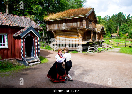 Costumed interpreters perform folk dancing at the open-air Norwegian Museum of Cultural History  Norsk Folkenmuseum Oslo Norway Stock Photo