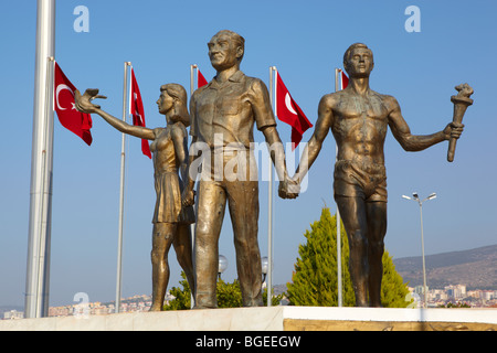 Monument of Ataturk and Youth, Kusadasi, Turkey with Turkish flags in the background. The monument signifies peace and hope Stock Photo