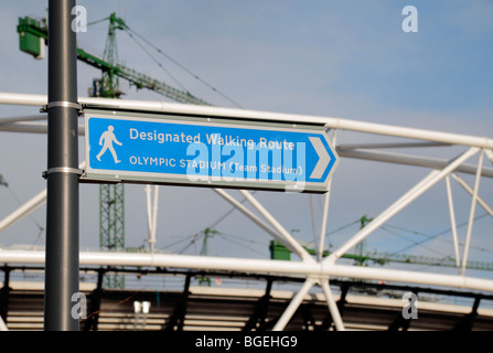 Pedestrian sign in front of th partly constructed London 2012 Olympic Athletics Stadium in Stratford, East London. (Jan 2010) Stock Photo