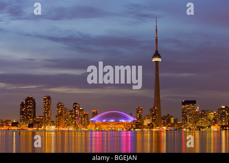 Skyline of Toronto with CN Tower and Rogers Centre at dusk, over Lake Ontario, City of Toronto, Ontario, Canada. Stock Photo