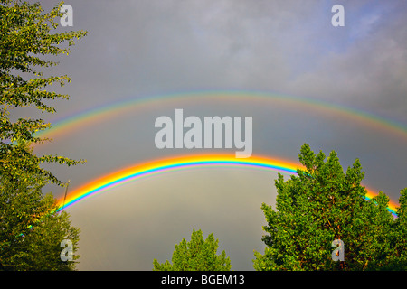 Rainbow forming during a thunder storm in the city of Regina, Saskatchewan, Canada. Stock Photo
