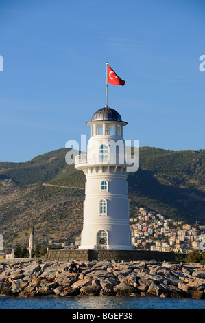 Lighthouse with turkish flag in the harbour of Alanya, Turkey, Türkiye, Alanya, Mediterranean Sea Stock Photo