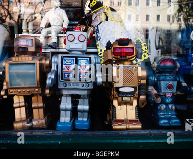 Detail of toy robots in window of trendy fashion boutique in bohemian Prenzlauer Berg district of Berlin Germany Stock Photo