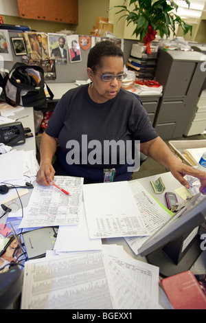 Detroit, Michigan - A Detroit Public Schools secretary on the job in the school system's central office. Stock Photo