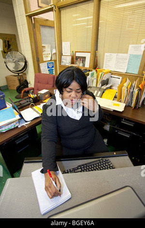 Detroit, Michigan - A Detroit Public Schools secretary on the job at Malcolm X Academy. Stock Photo