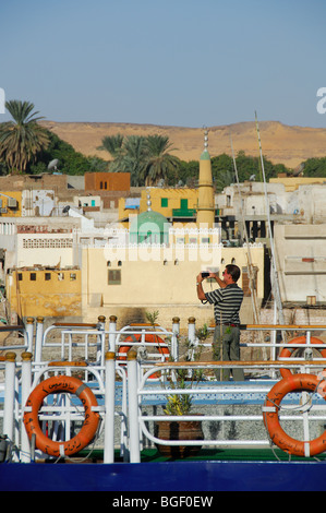 ASWAN, EGYPT. Looking across to Elephantine Island from Nile cruise boats moored by the Corniche. 2009. Stock Photo