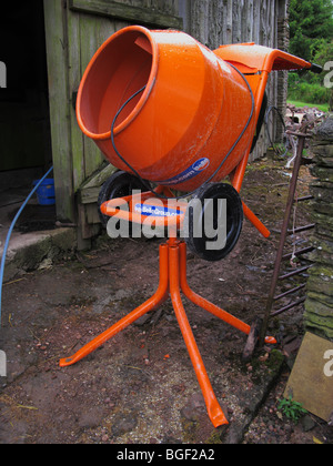 small electric powered cement mixer in Farmyard somerset uk Stock Photo