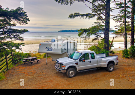 Camper and pick up truck at the Bella Pacifica Resort and Campground, MacKenzie Beach, near Tofino, a transition area of the Cla Stock Photo