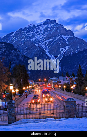 Banff Avenue at night with Cascade Mountain (2998 metres/9836 feet) in the background as viewed from the grounds of the Parks Ca Stock Photo