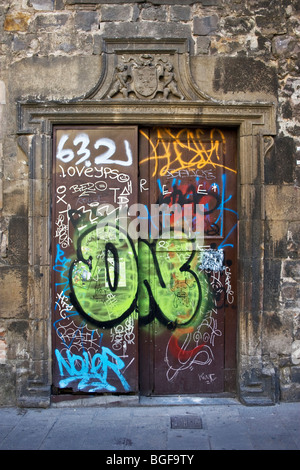 Graffiti on historic door, Casa de la Congregació de la Puríssima Sang, Plaza del Pi, the Gothic Quarter, Barcelona, Spain Stock Photo