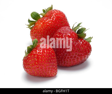 Three beautiful whole red strawberries together Stock Photo