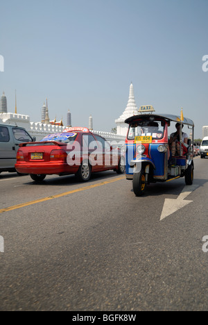 Tuk-tuk and taxi in street near the Grand Palace; Bangkok; Thailand Stock Photo