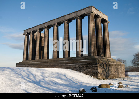 The National Monument on Edinburgh's Calton Hill on a clear winter's day. Snow lies on the ground in the foreground. Stock Photo