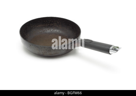 Old rusty frying pan on white background Stock Photo