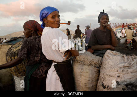 A woman smoking a pipe at the port in Gonaives, Artibonite Department, Haiti. Stock Photo