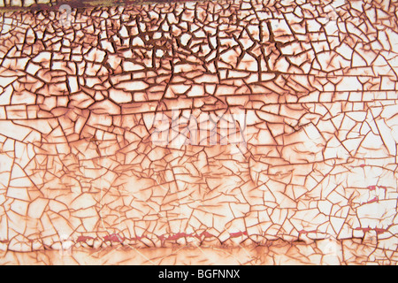 old, rusty white painted metal, cracked from underlying rust Stock Photo